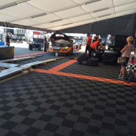 RaceDeck Free-Flow XL flooring for a racing paddock