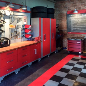 Red, black and gray home shop with matching RaceDeck Diamond flooring