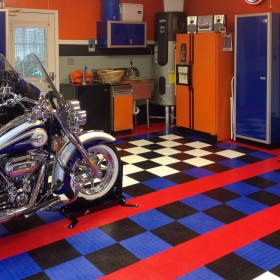 Two Harleys in a home garage with CircleTrac coin flooring.