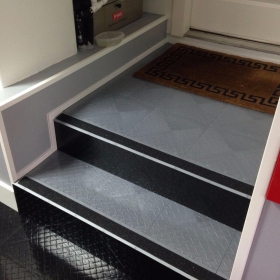 RaceDeck Diamond with TuffShield on the stairs transitions from the house to the garage.