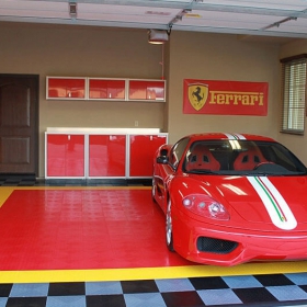 Ferrari in a garage with a custom designed Red and Yellow RaceDeck Diamond garage floor.