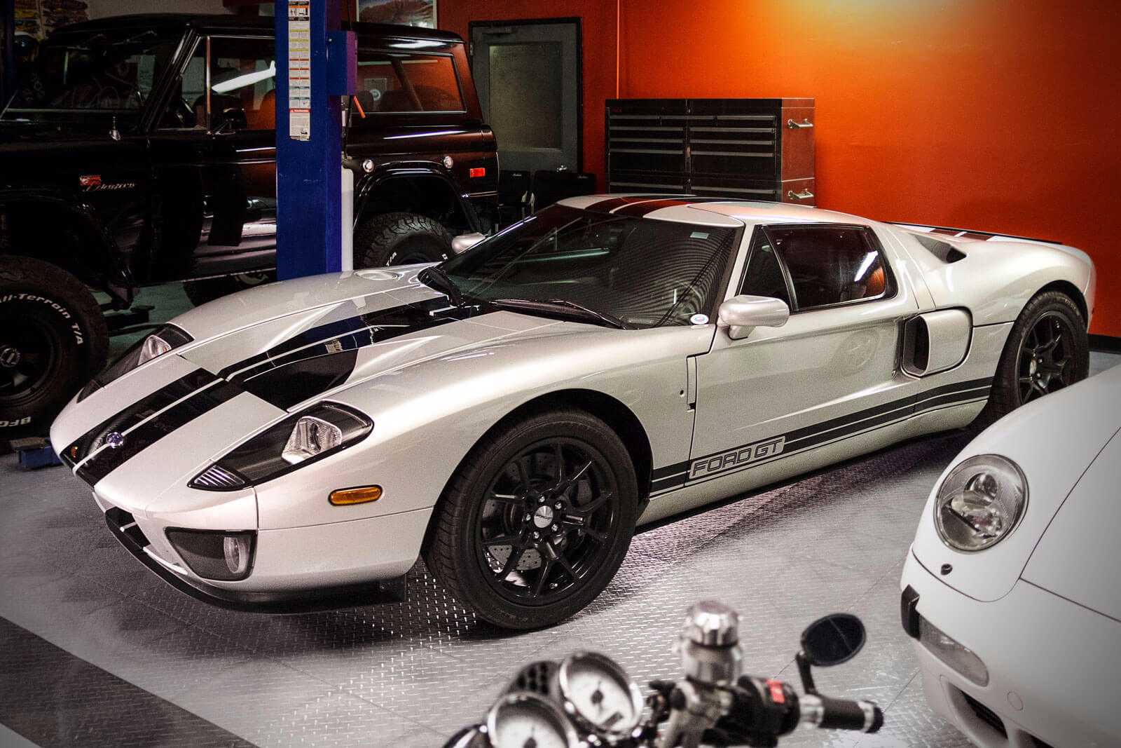 Ford GT and more vehicles in a RaceDeck Diamond floored garage