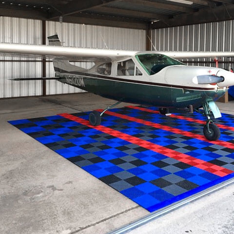 Free-Flow XL and regular Free-Flow parking pad for a plane hangar.