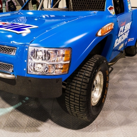 Off-road racing truck parked on RaceDeck Diamond