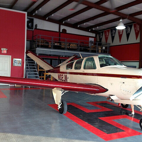 RaceDeck Diamond alloy, black and red with custom H pattern, hangar flooring.