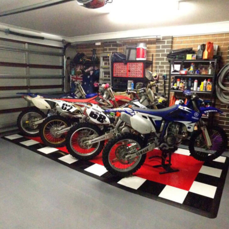 Motorcycle display pad with RaceDeck tile flooring.
