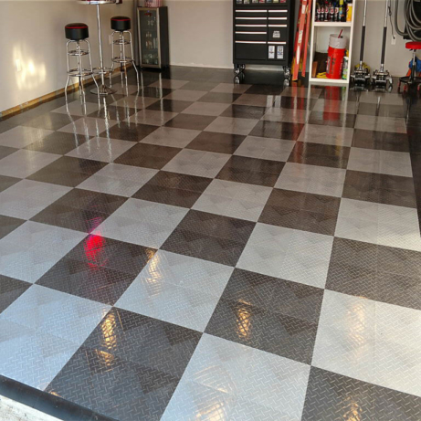 Glossy RaceDeck Diamond with Tuffshield sets the stage for this clean home garage.