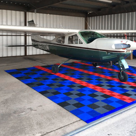 Free-Flow XL and regular Free-Flow parking pad for a plane hangar.