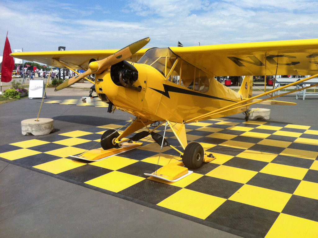 Black and yellow checkered airplane pad with edging.