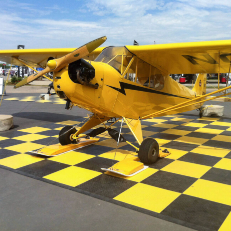 Black and yellow checkered airplane pad with edging.