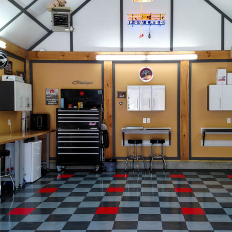 A clean garage in RaceDeck Diamond garage flooring tile with TuffShield®