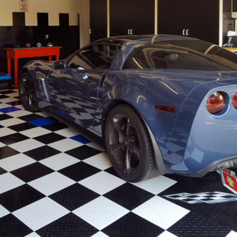 A Corvette on RaceDeck Diamond with Tuffshield® and a custom logo