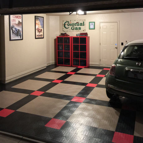A home garage at night with a Fiat 500 and CircleTrac
