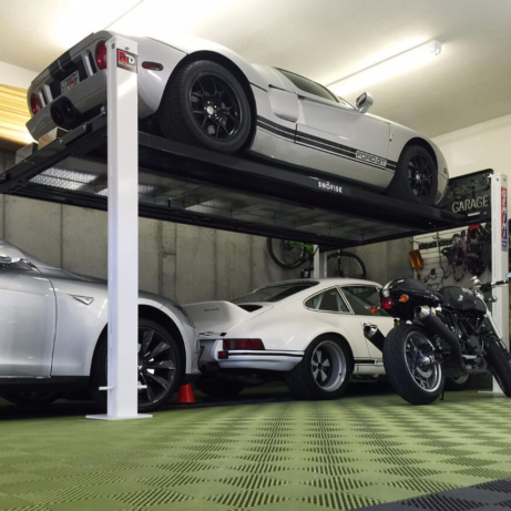 A Ford GT, a Porsche, a BMW, and a Ducati all in one garage with RaceDeck Free-Flow