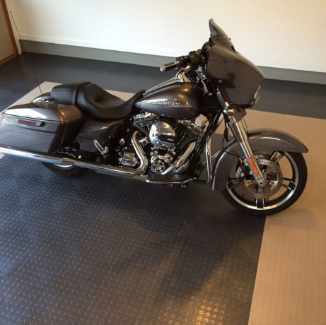 A Harley-Davidson on a CircleTrac garage floor