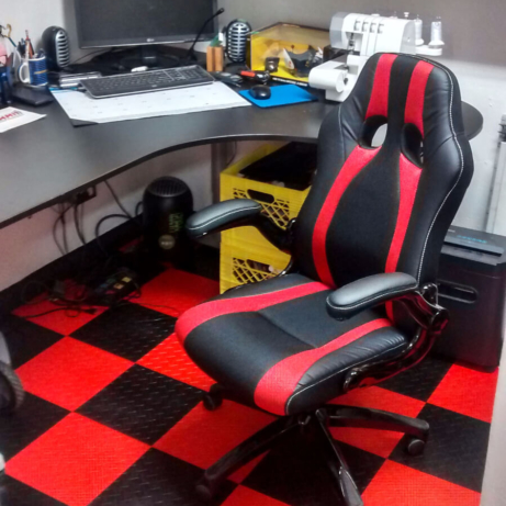 The black and red flooring extends to this office area.