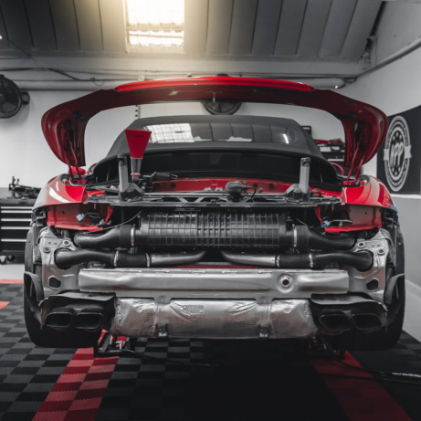 Porsche 911 Turbo S in shop with black and red Free-Flow