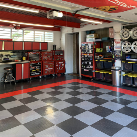 RaceDeck Diamond in graphite, alloy, and red in Porsche themed garage