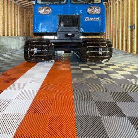Thiokol Spryte Snowcat parked on Free-Flow XLC commercial-grade garage tiles
