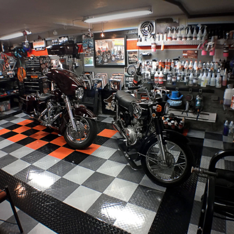 Harley garage in Quebec with high-gloss Diamond TuffShield flooring to match.
