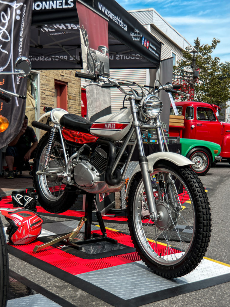 Sweet Ride Canada display motorcycle pad with various RaceDeck Garage Flooring