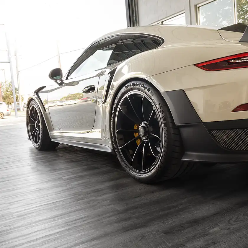 Porsche and Smoked Oak in the showroom at Luxe auto.