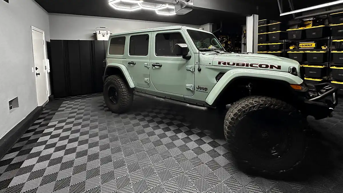 A Jeep Rubicon parked in a garage with Free-Flow garage flooring