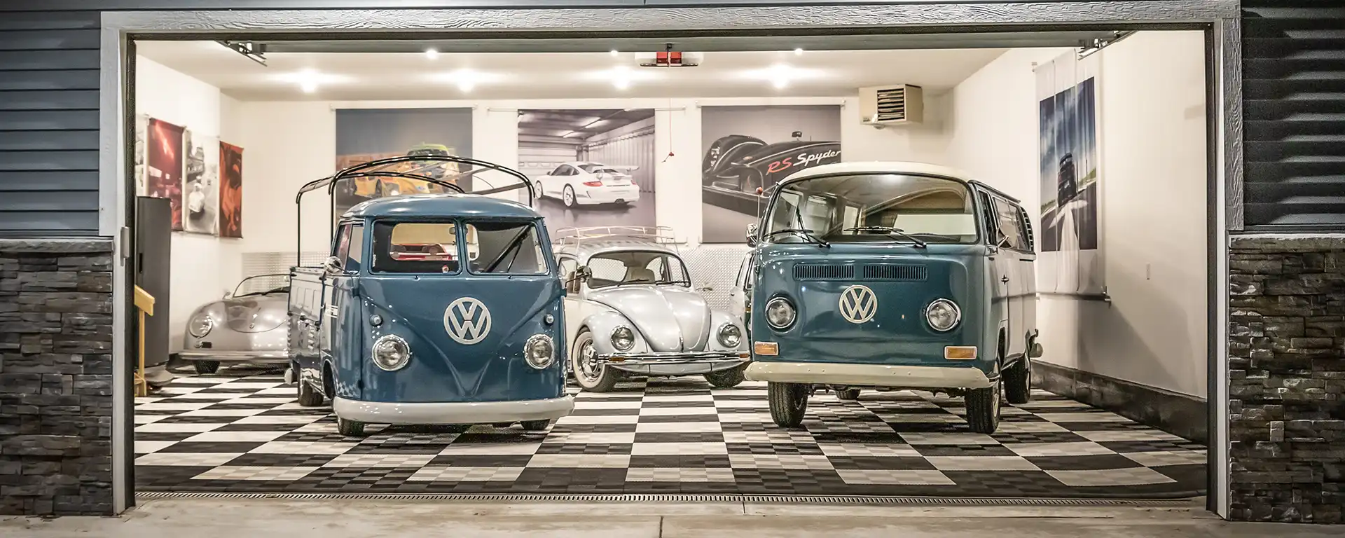 Custom Garage Flooring in a garage with two vintage VW busses and a Beetle