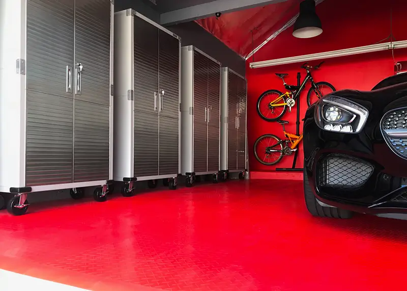 Mercedes in a garage with red interlocking tiles